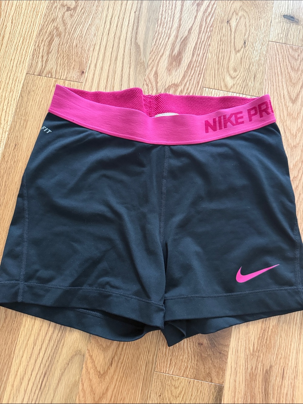 Nike Women’s Black Athletic Shorts with Pink Waistband and Swoosh